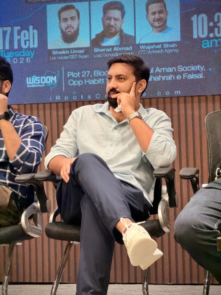 Usama Tanveer seated on the IT experts panel at iRoots College